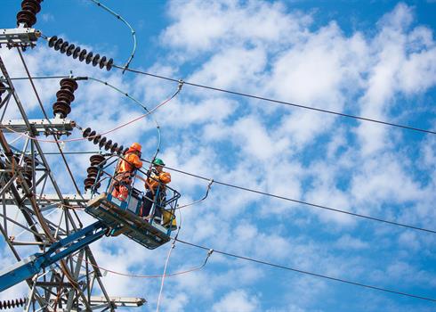 photo of Hydro One workers on a transmission tower