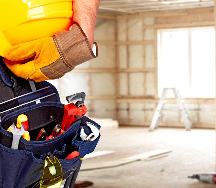 photo of a builder holding a hard hat