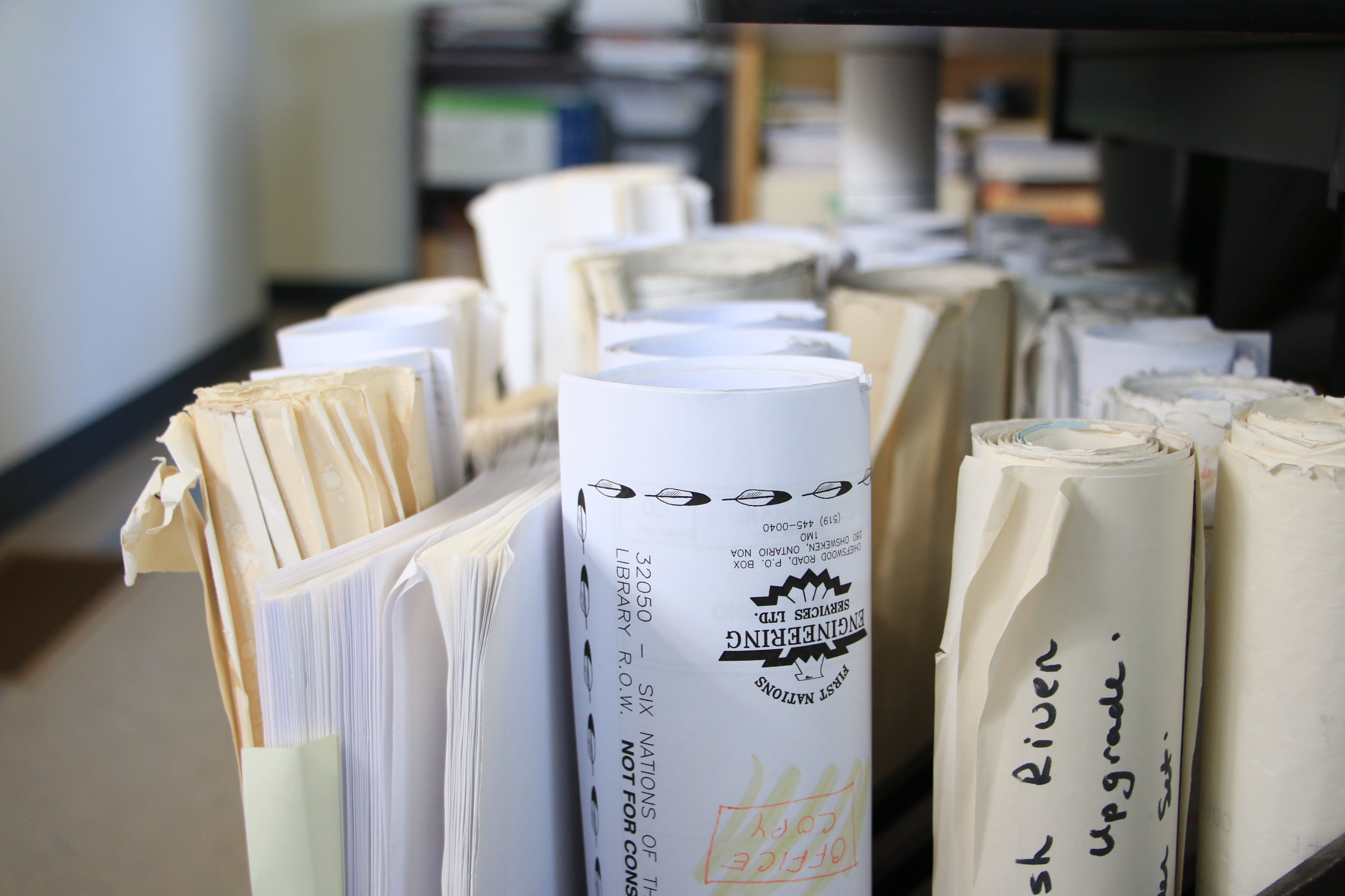 image of rolled up maps in a box