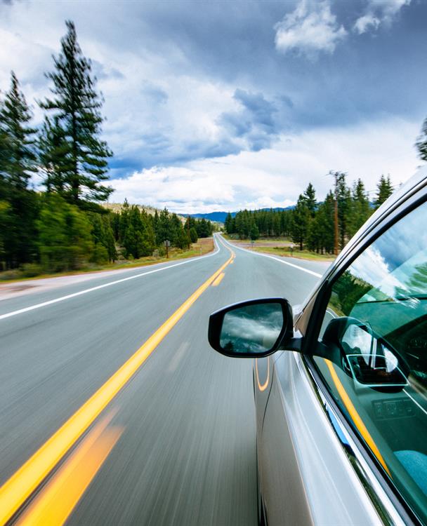 Photo of an electric vehicle on a highway