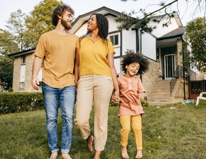 image of family on their front lawn