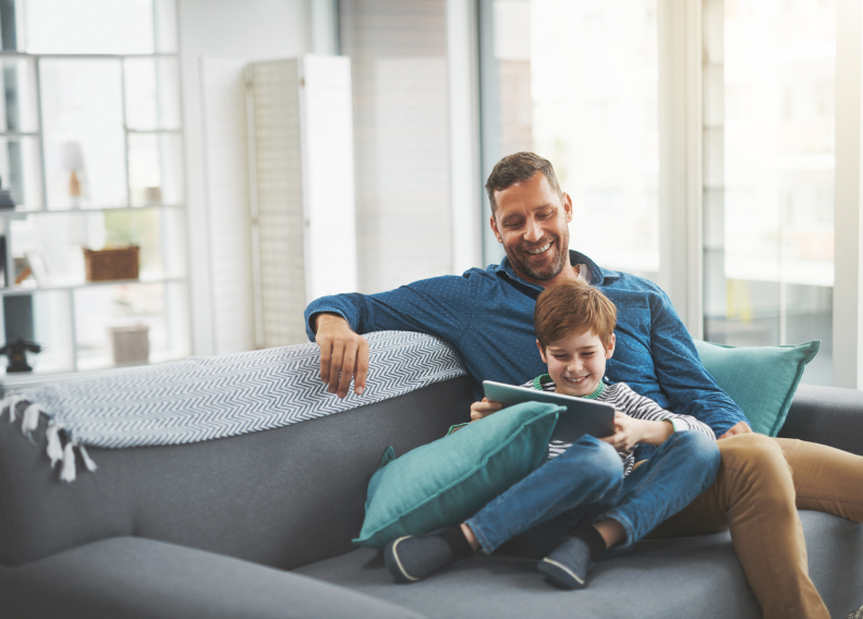 family sitting on couch