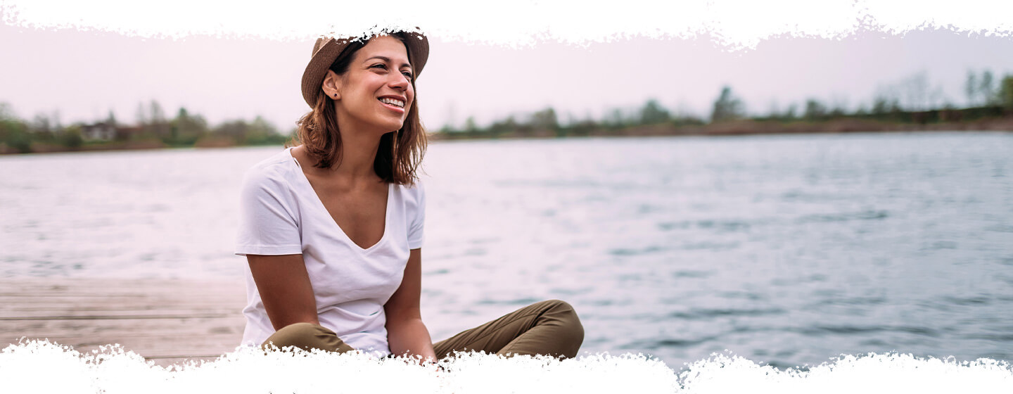 person sitting on dock