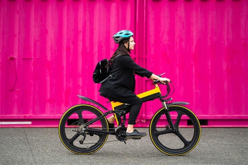 photo of a girl riding an e-bike