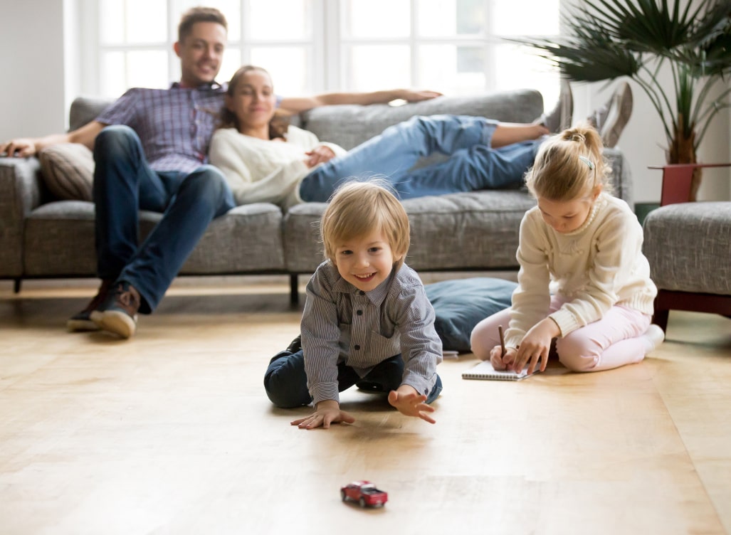 Family sitting on the couch together