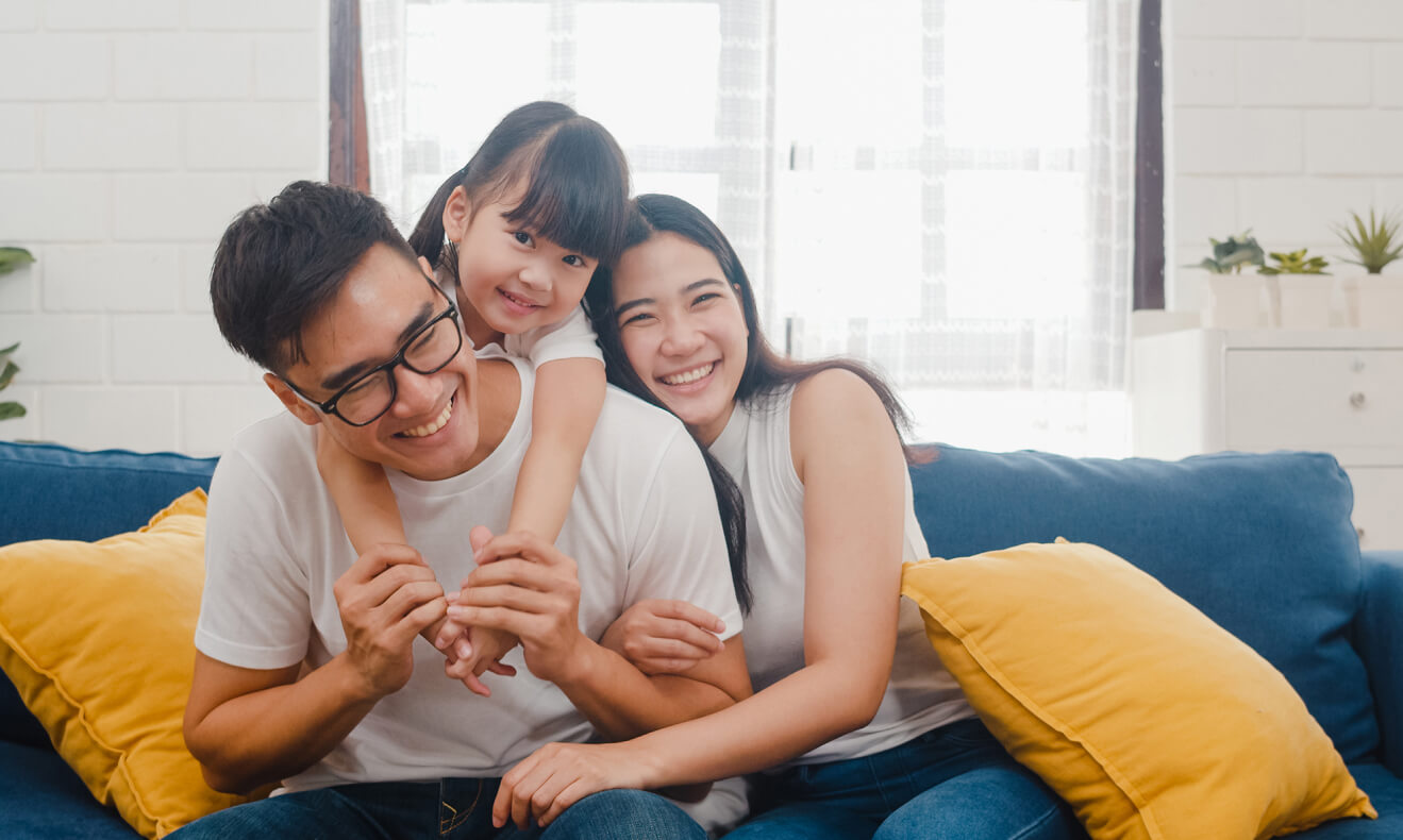 Family sitting on couch