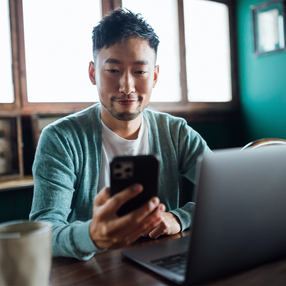 image of man on his phone