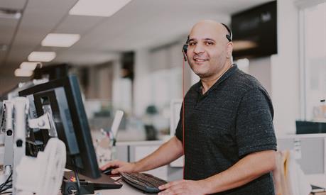A customer support representative wearing a headset