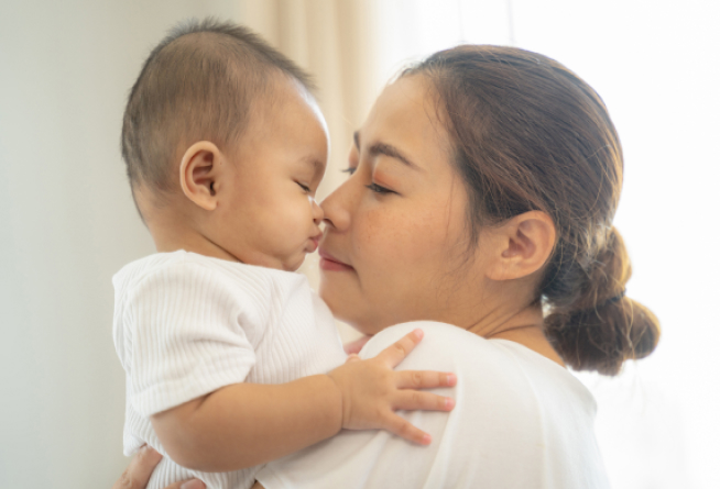 Mother holding her baby