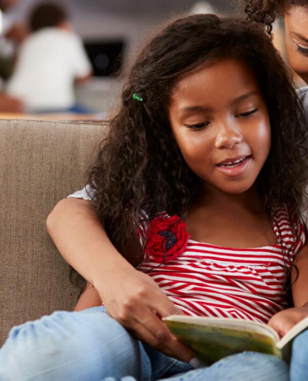 photo of an woman and her daughter reading