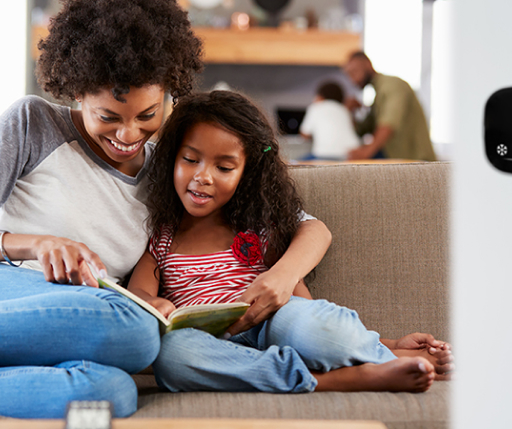 Family sitting on couch together
