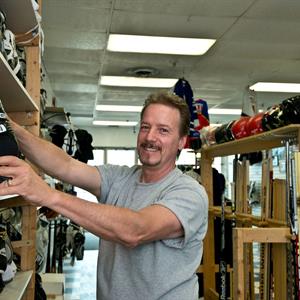 Image of a man in his sports store