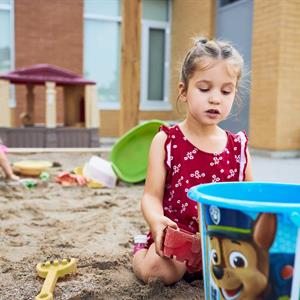 image of children playing in a sandbox